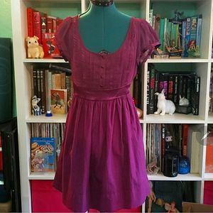 A) Magenta ruffle alice in wonderland dress with pockets